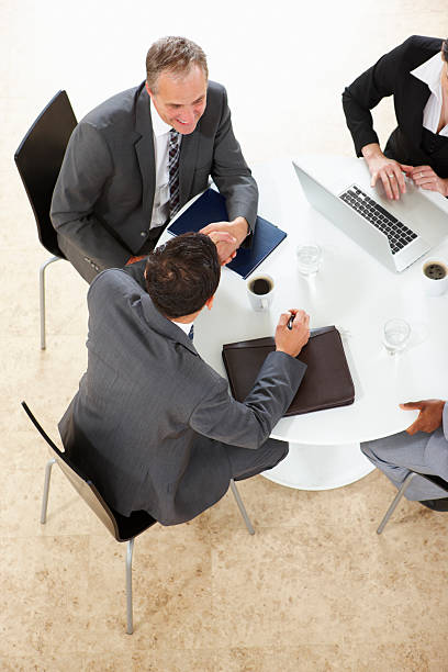 istock arial view of Business Group Working on a laptop 183807387