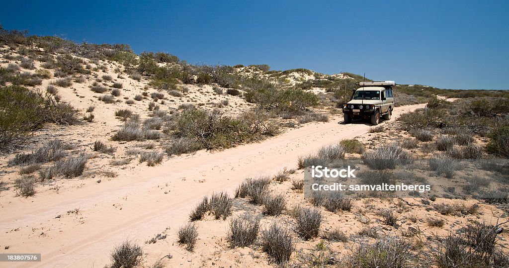 Cape Range National Park 4WD A 4WD vehicle traversing the vast expanse of Cape Range National Park in central Western Australia.  Cape Range borders the pristine waters of the famous Ningaloo Reef Marin Park. Australia Stock Photo