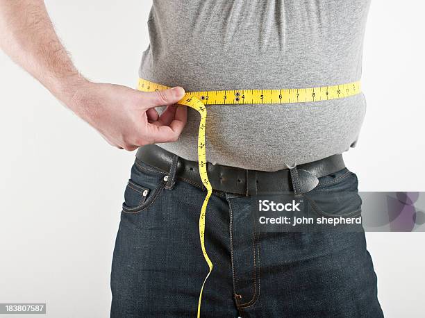 Man With Excess Weight Measuring Stomach Stock Photo - Download Image Now - Abdomen, Adult, Adults Only