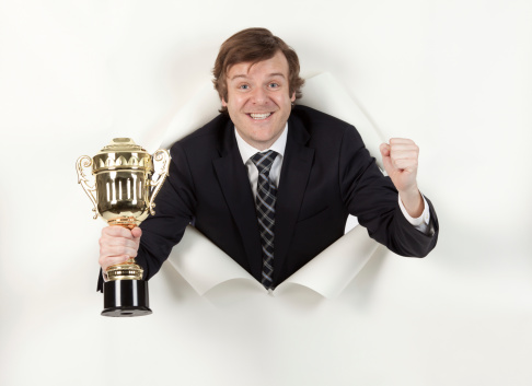 Successful businessman with a trophyhttp://www.twodozendesign.info/i/1.png