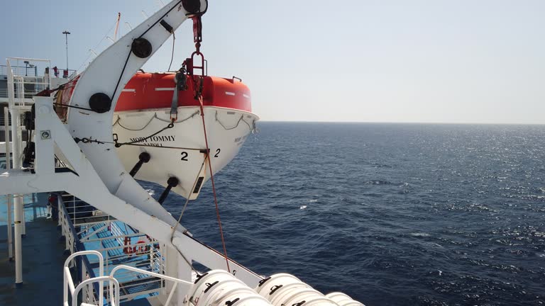 View from a ferry in navigation with a lifeboat in the foreground