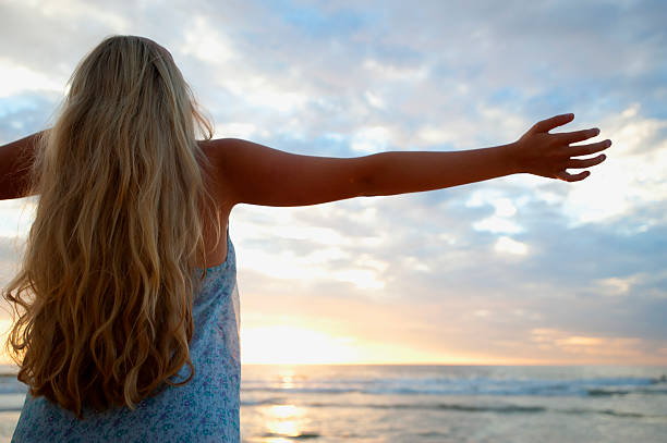 istock Young woman with arms out 183808042