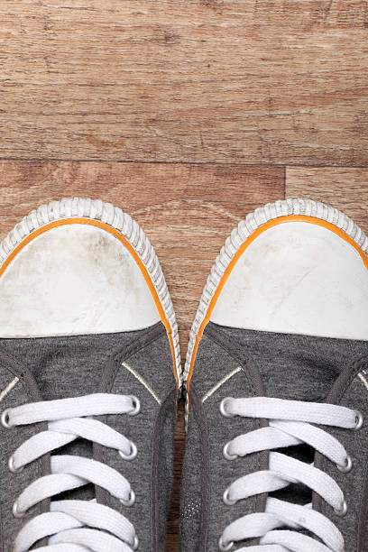 istock Trainers on a wooden floor 183808171