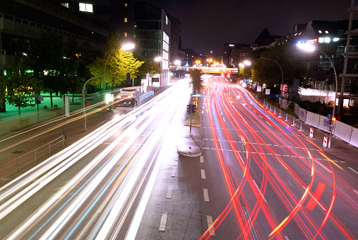 Long exposure shot of traffic light trails on city streets at night