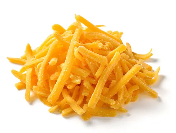"One ounce serving, small pile of shredded cheddar or american cheese on white background with natural shadow.Shot with Nikon D3X"