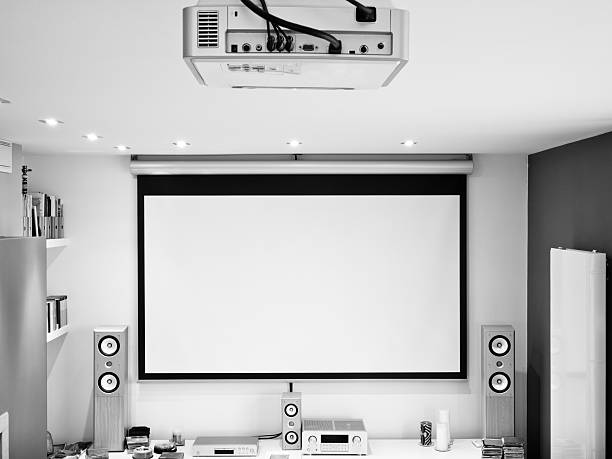home theater system, HD projector, large screen, hifi sound system Home theater system. HD projector, large 102 inches screen and hifi 6.1 sound system. Processed for black and white. stereo photos stock pictures, royalty-free photos & images