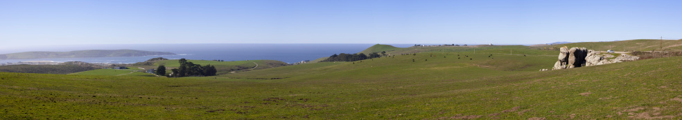 A panoramic of the mouth of Tomales Bay and green Sonoma Coast dairy country.  The rock formation to the right is Elephant Rock.