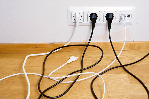 istock Plugs connected to the outlet in a wall 183809052