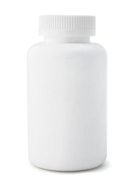 An unmarked white medicine bottle  Isolated blank medicine bottle on a white background. pill bottle photos stock pictures, royalty-free photos & images