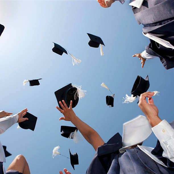 istock Graduation Caps Thrown in the Sky 183810061