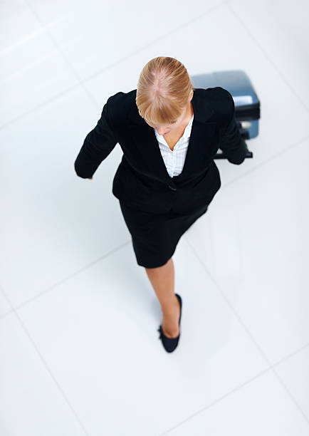 istock Businesswoman with her luggage 183810133