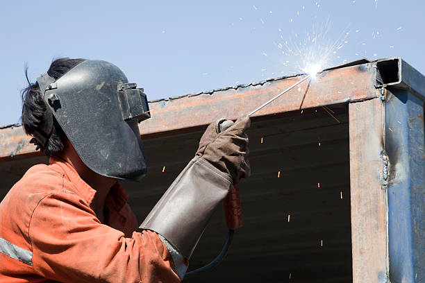 Welder On the high place Welding high place in front of sky welding helmet stock pictures, royalty-free photos & images