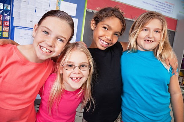 istock Happy Elementary Friends in Their Classroom 183810602