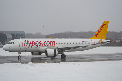 Turkish low-cost airline's Pegasus Airlines Airbus A320 slowing down after landing at Lviv Airport