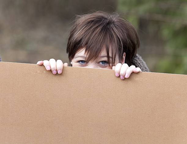 istock red hair female behind billboard 183811167