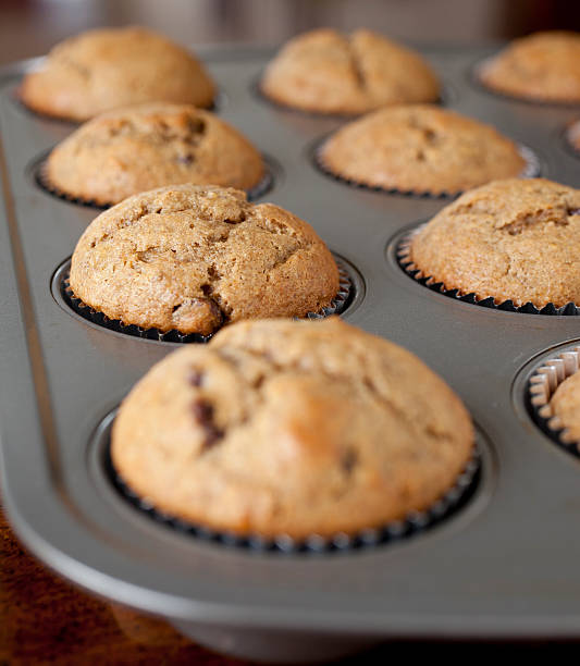 istock Whole Wheat Banana Chocolate Chip Nut Muffins in Tin Pan 183811540