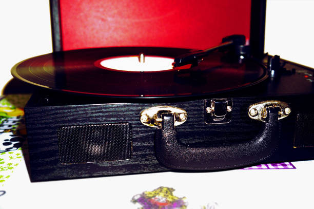 istock Vinyl player in portable suitcase format with a red background and a vinyl record inside. 1838116626
