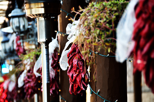 Chili Ristras hanging on a streetside in Old Town Albuquerque New Mexico.