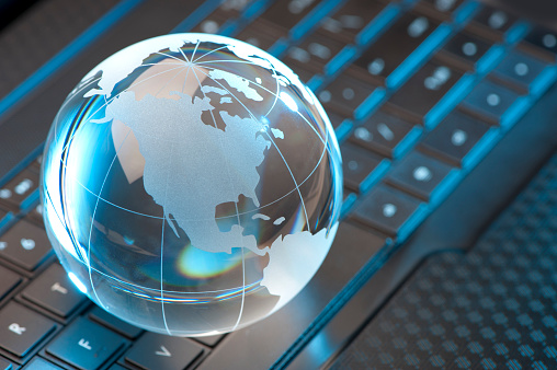 Glass Globe and Computer Keyboard with blue highlights