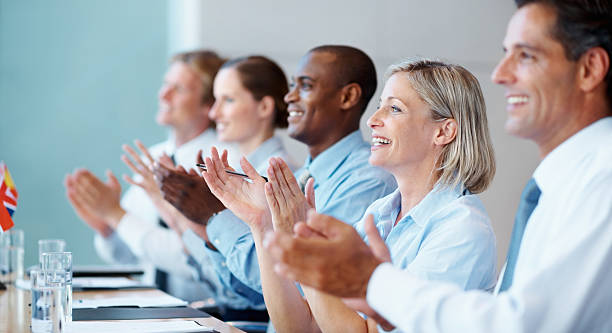 istock Happy business team applauding 183812252