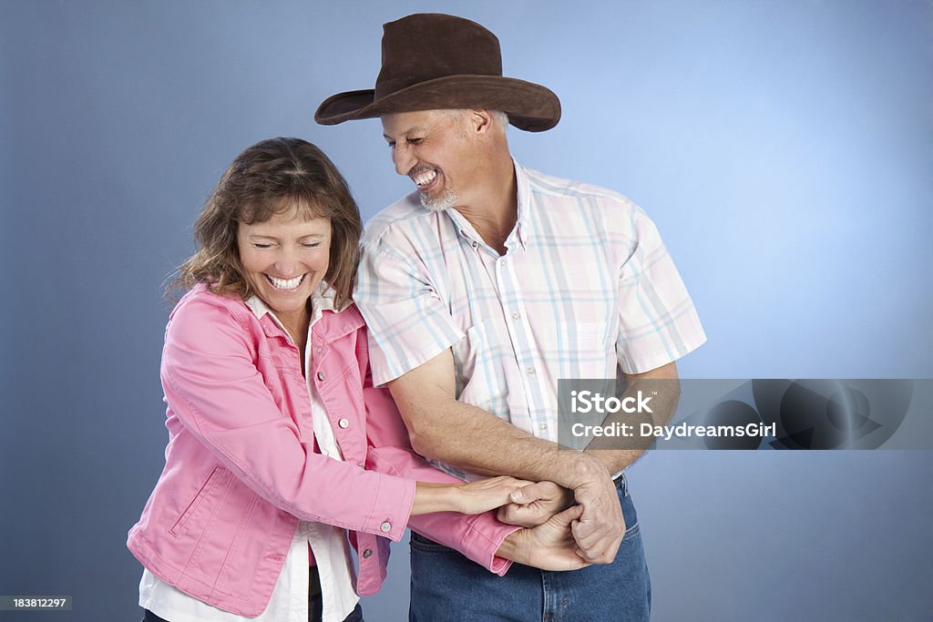 Portrait of Attractive Happy Mature Western Couple Portrait of a mature married husband and wife. Dancing Stock Photo