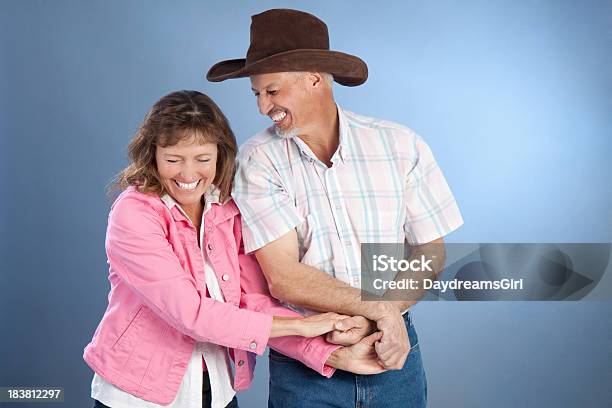 Portrait Of Attractive Happy Mature Western Couple Stock Photo - Download Image Now - Dancing, Wild West, Couple - Relationship