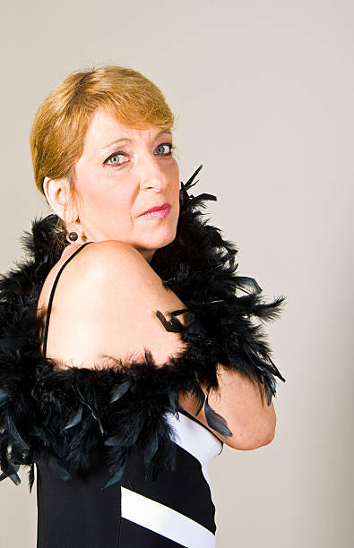 istock Middle Age Woman with Feather Boa 183812466