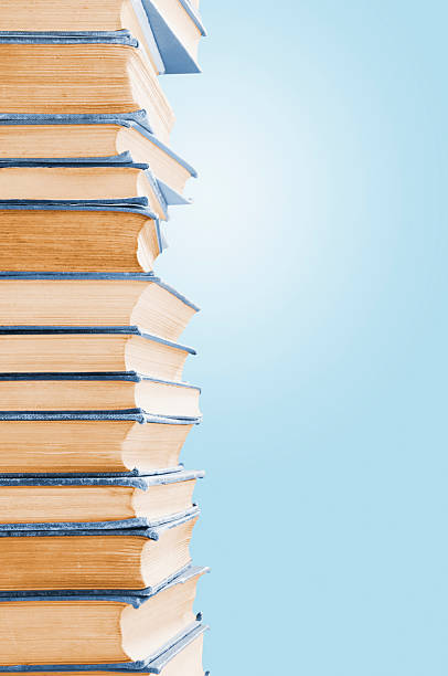 istock Pile of old blue leather covered books with copy space 183812588