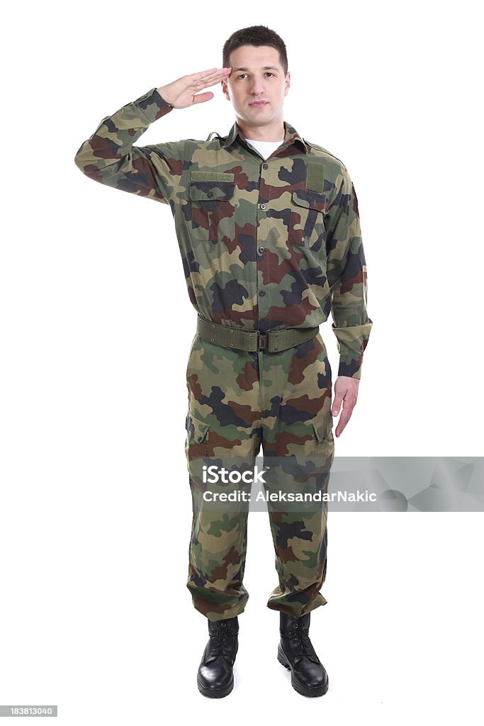 Full length portrait of a soldier saluting Adult Stock Photo