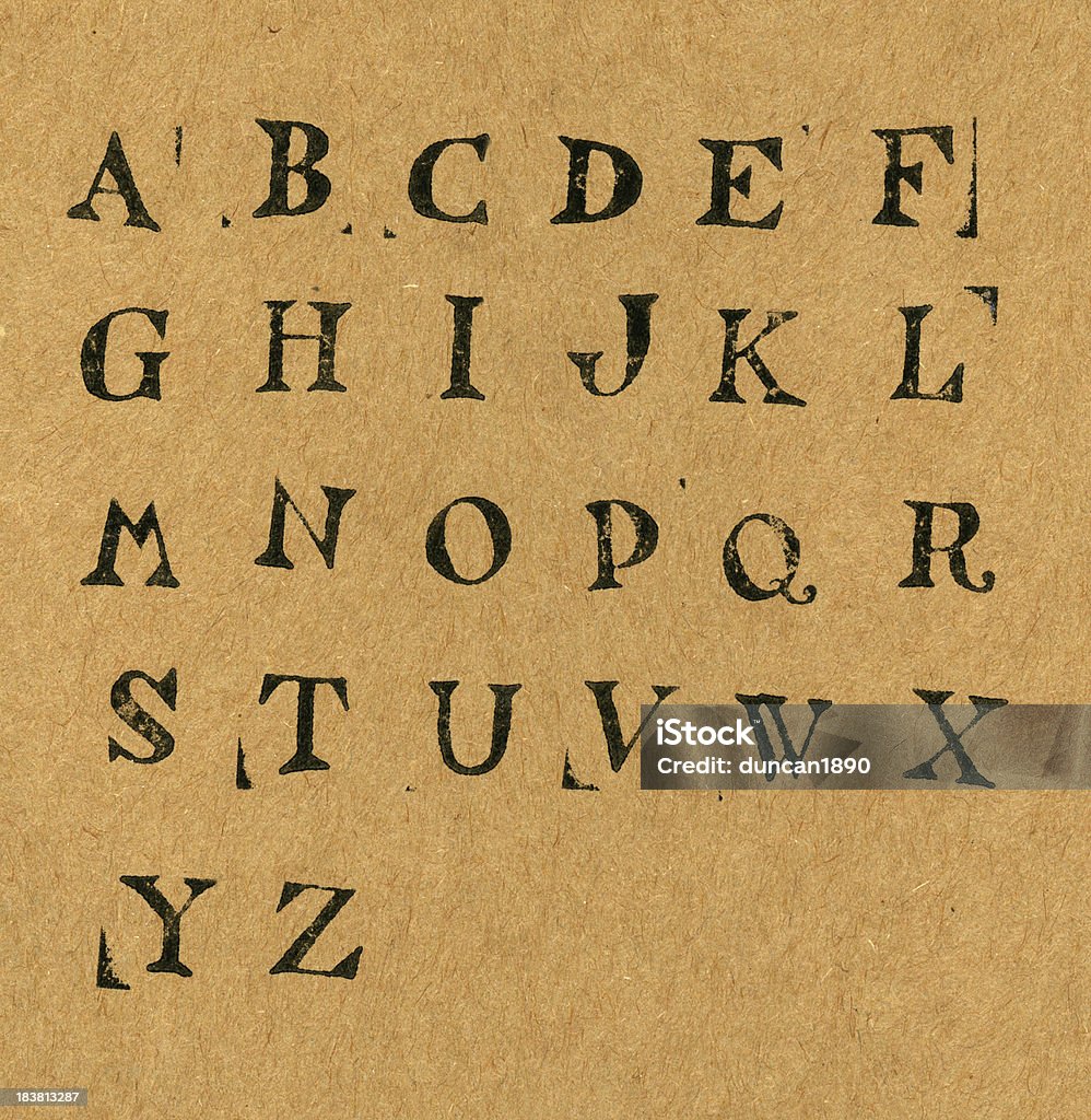 Alphabet The Alphabet ink stamped on a sheet of course brown paper Letter F stock illustration