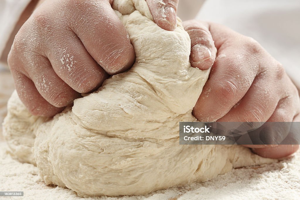 Kneading Dough Closeup of a woman kneading dough. Baker - Occupation Stock Photo