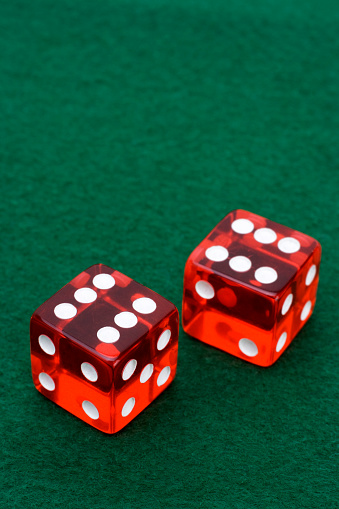 Pair of Dice on green felt table 