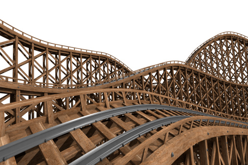 Wooden roller coaster track isolated on a white background.Could be useful in a amusement park composition.This is a detailed 3d rendering