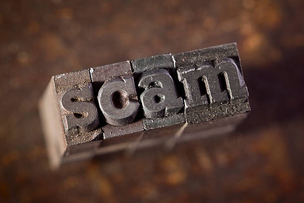 istock SCAM written in old letterpress against wood background 183815186