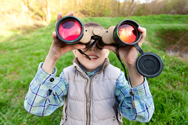 istock Little boy looking out of binoculars 183815275