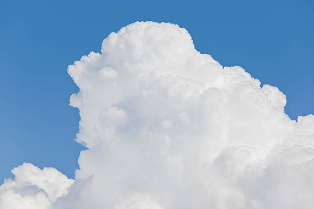 istock Big white cumulus cloud with blue sky 183815322