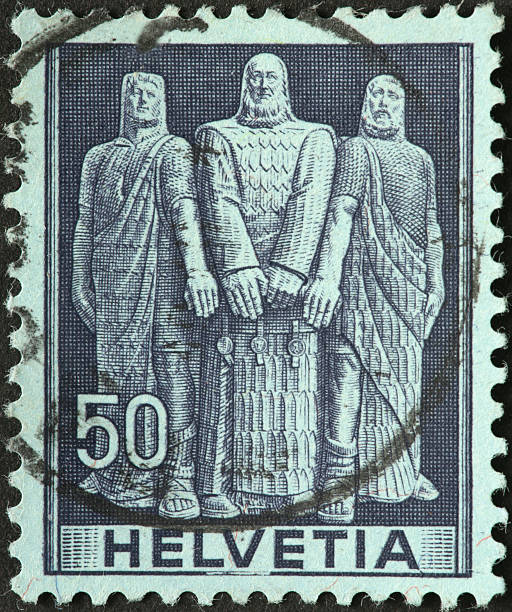 istock three tall male statues on an old Swiss stamp 183815324
