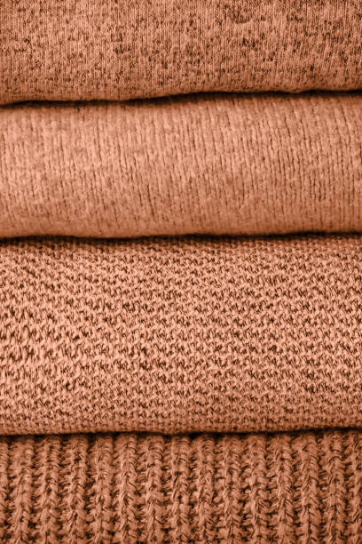 istock stack of knit sweaters peach color trend 2024 1838155762