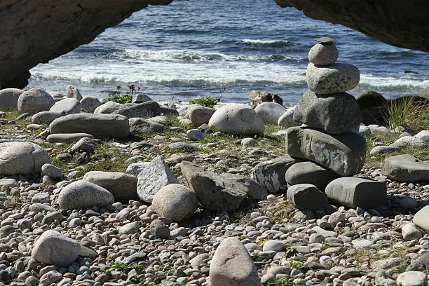 Photo of stacked stones on the beach