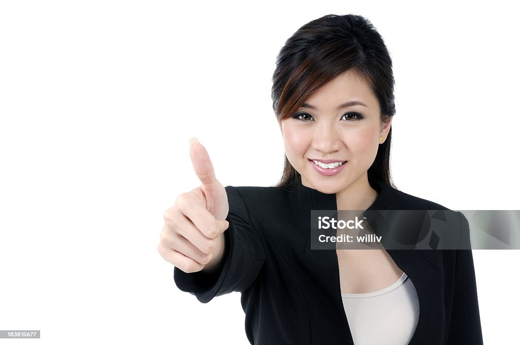 Beautiful businesswoman giving thumb up sign Portrait of an attractive businesswoman giving thumb up sign over white background. 20-24 Years Stock Photo