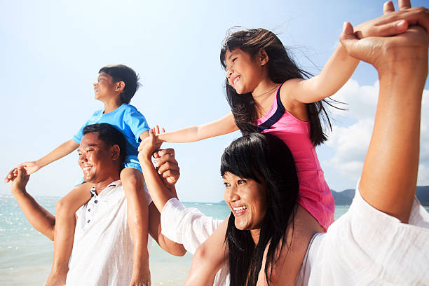 istock Asian family on the beach. 183816007