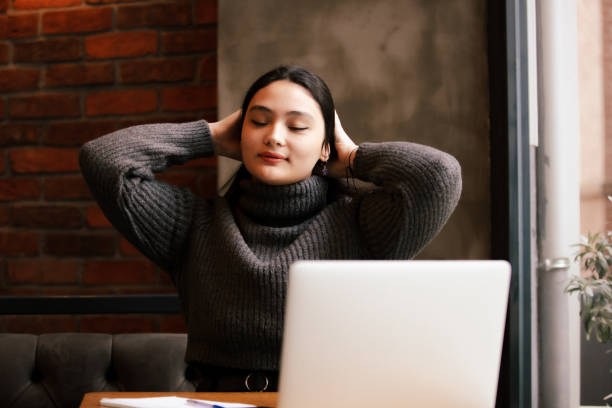 istock Young girl is studying at cafe. 1838160581
