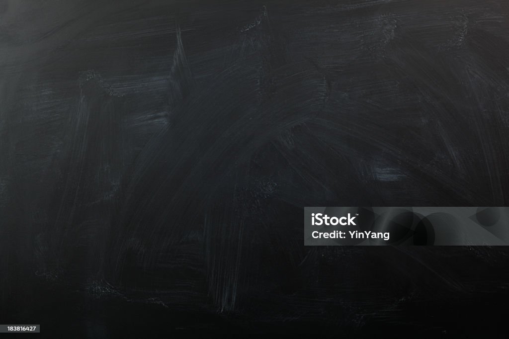Chalk Blackboard, a Black Color, Blank Slate, Education Background Texture "Subject: Horizontal view of a blank blackboard with a smeary erased chalk texture, for use as a background for educational topics." Textured Stock Photo