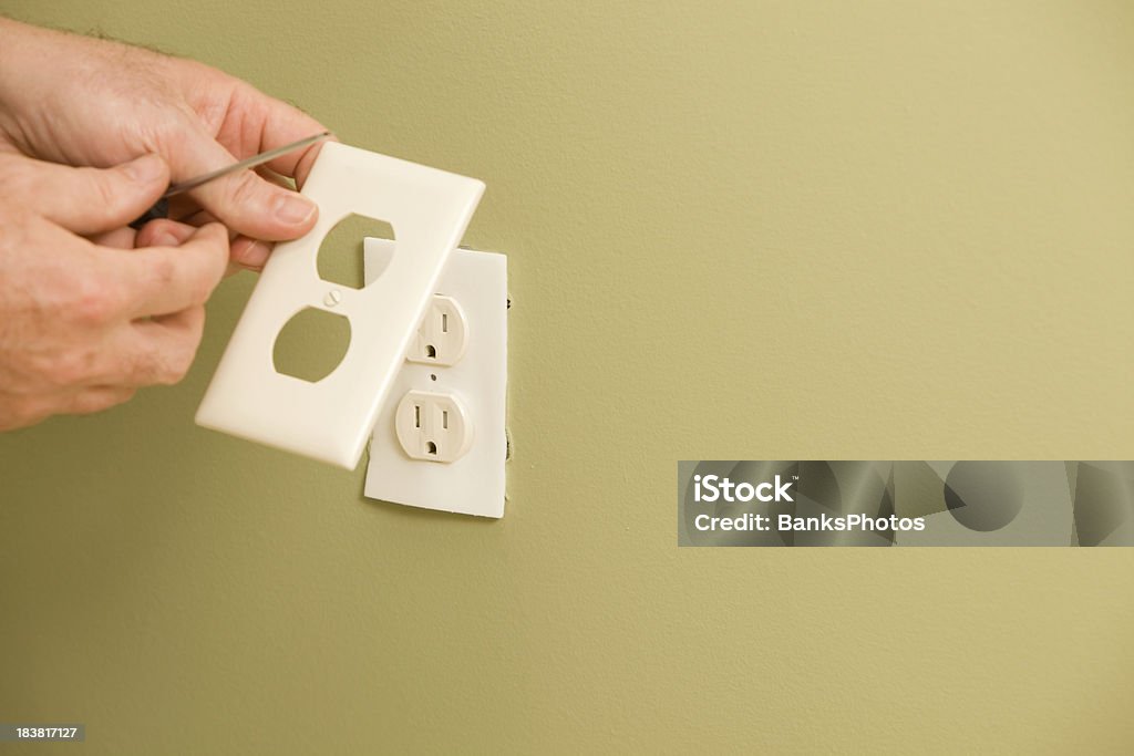 Electrician Installing Electric Outlet Insulation Pad  Electrical Outlet Stock Photo