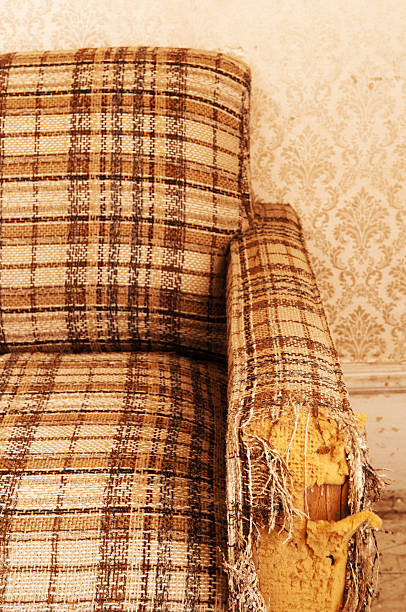 Retro Sofa Retro sofa in rough condition. plaid couch stock pictures, royalty-free photos & images