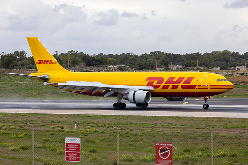 Luqa, Malta - December 5, 2023: DHL (ASL Airlines Ireland) Airbus A300B4-622R(F) (REG: EI-OZL) performing an extra flight to the usual 757 daily flight.
