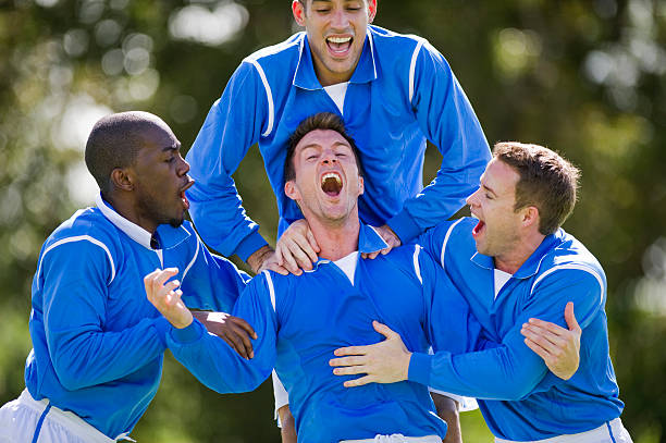 comemoração baliza de futebol - soccer celebration success group of people imagens e fotografias de stock