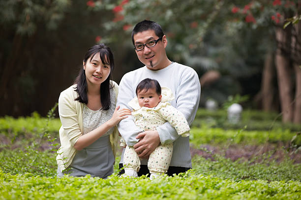 istock chinese family in a park 183818128