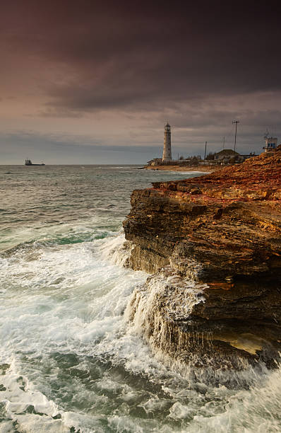 istock lighthouse over stormy sea 183818135