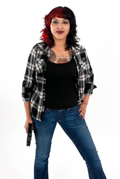 młoda kobieta z pistolet zabawka na białym tle - isolated glamour conflict action zdjęcia i obrazy z banku zdjęć